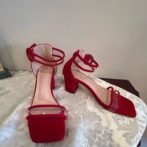 NWOT Red velvet type sandals NWOT. Size 38. Clear ankle strap trimmed in red.